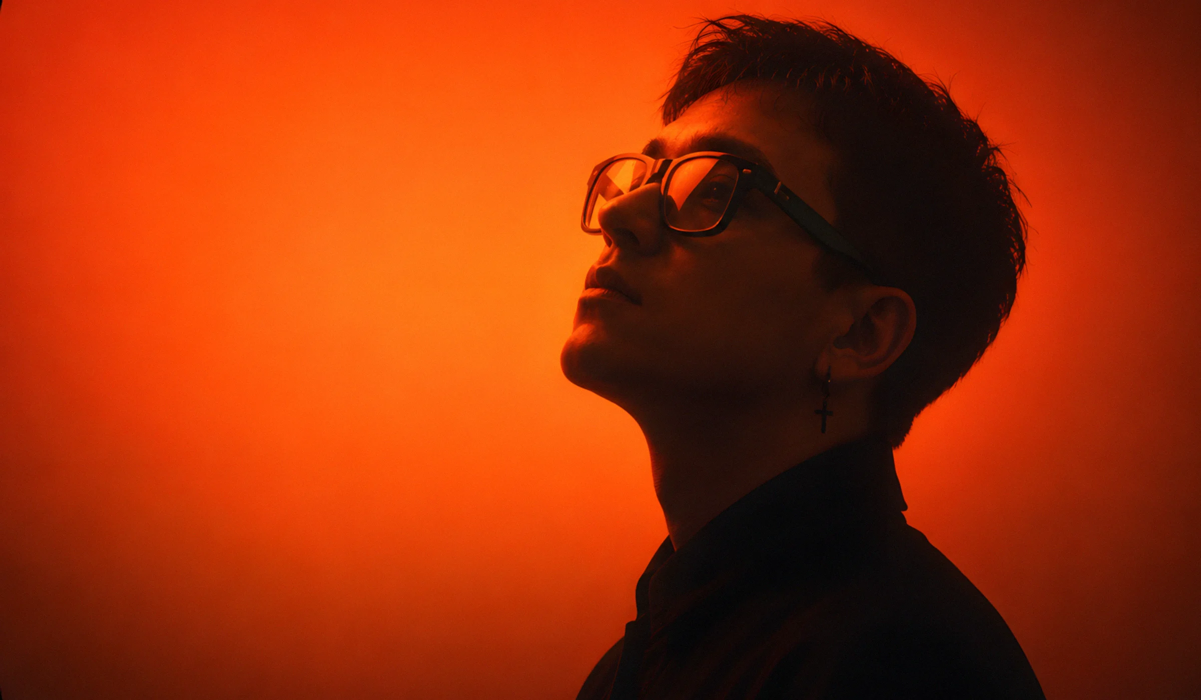 Cinematic dark pop night scene with amber light representing the FHUGAWZ universe.